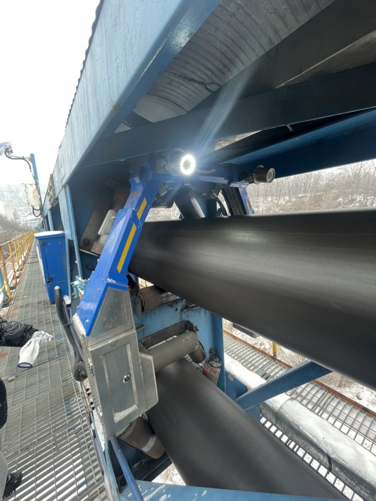Pipe conveyor belt system close-up